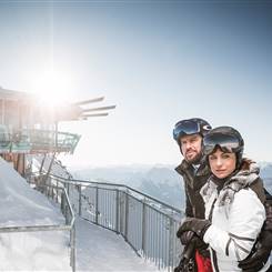Couple in ski outfit in front of Top Mountain Star